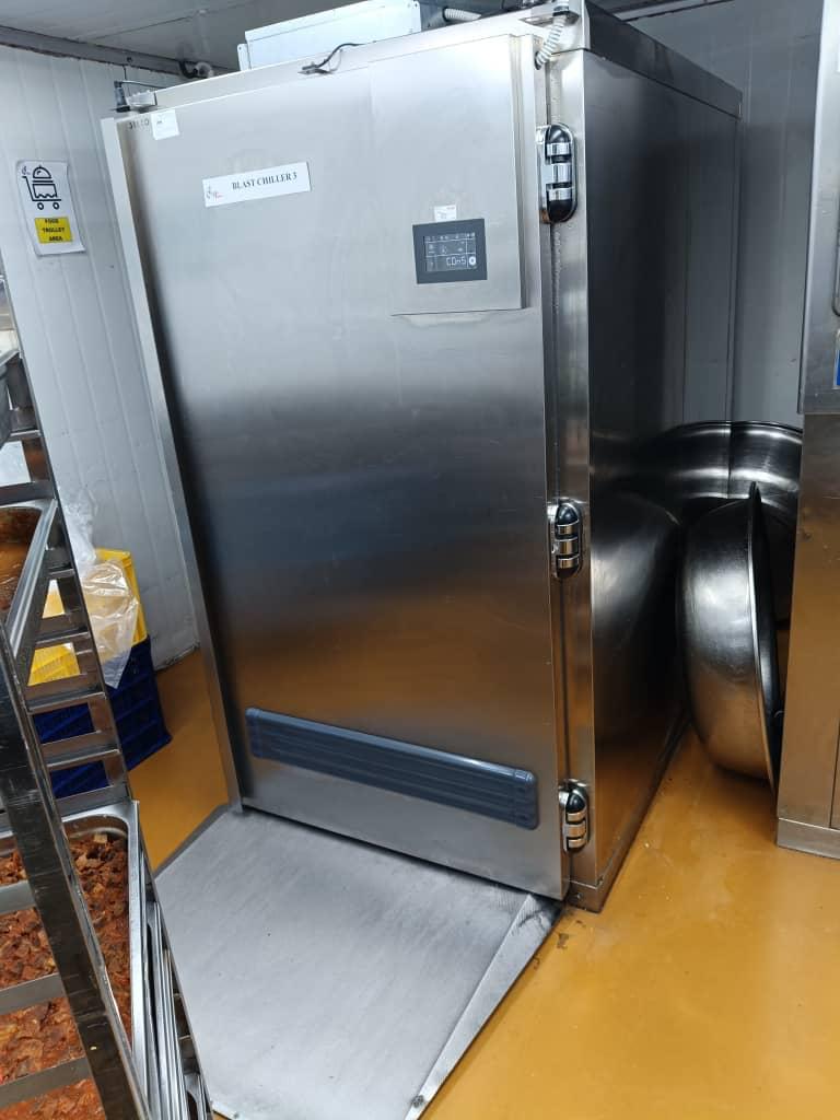 Stainless steel blast chiller with digital controller in a commercial kitchen