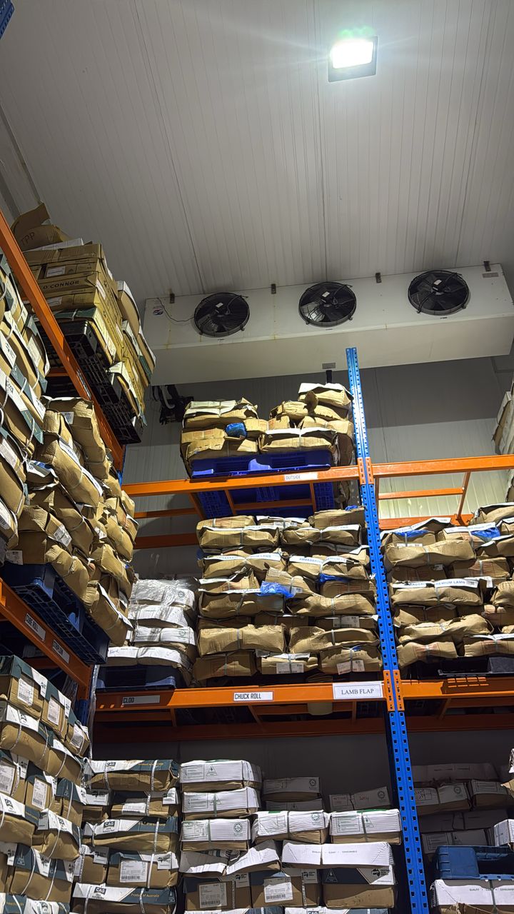 Cold storage room with stocked pallet racking