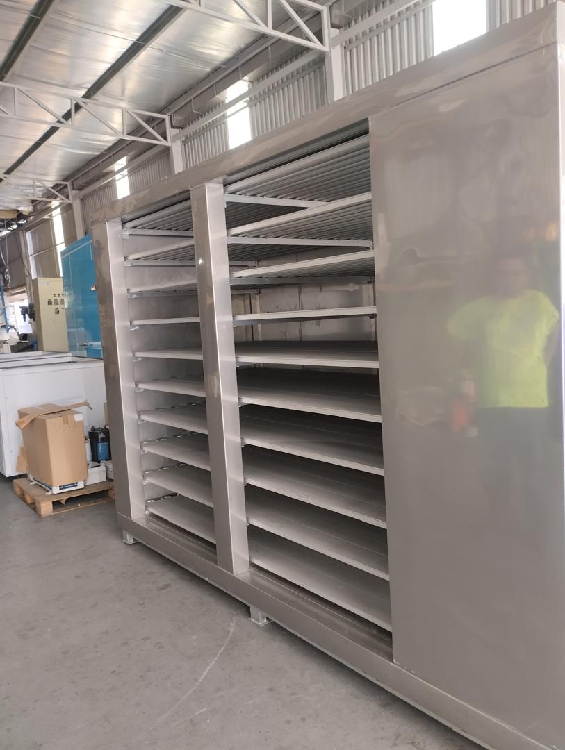 Stainless steel tray rack inside a custom blast freezer